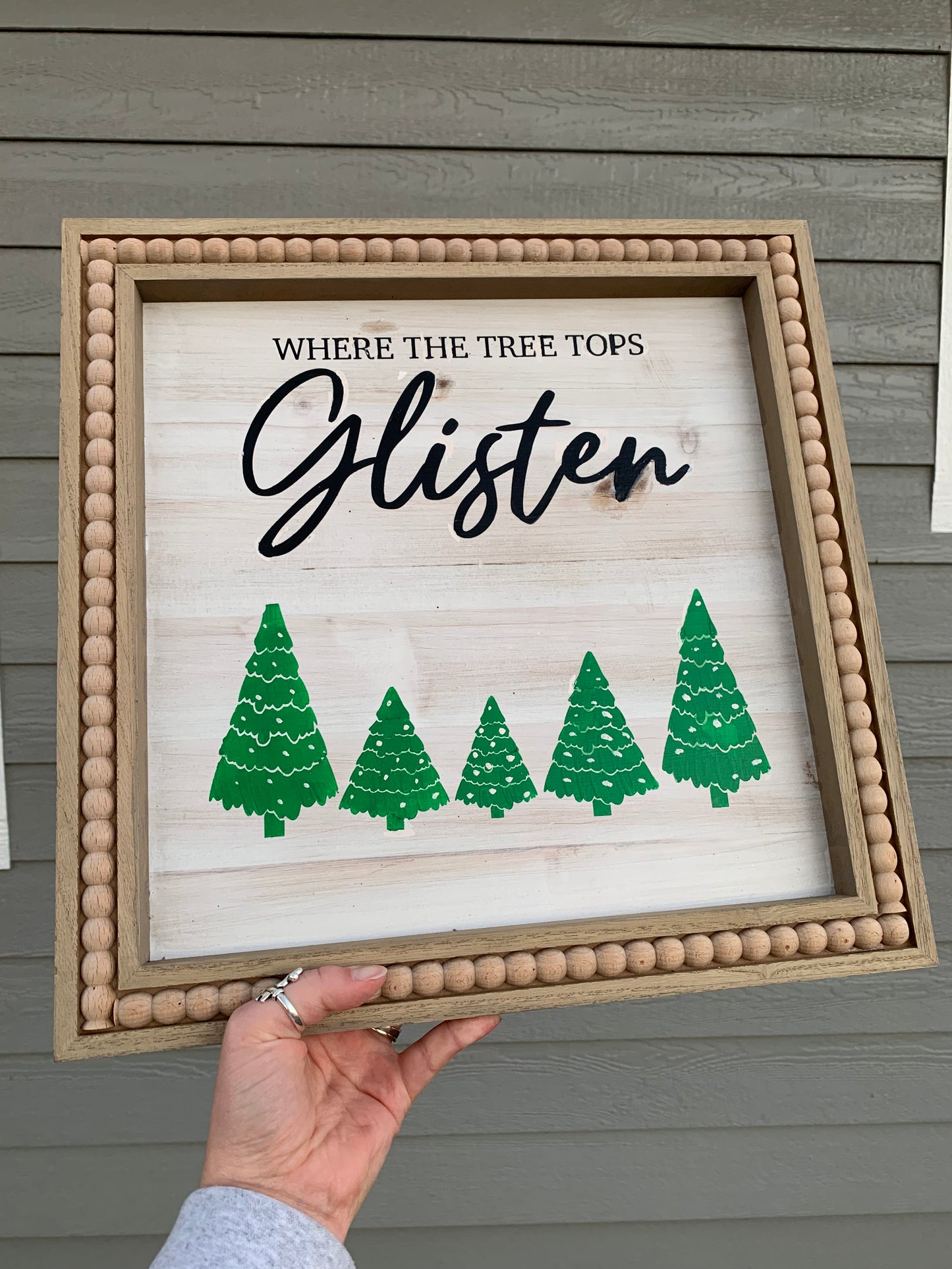 Tree Tops Glisten Sign